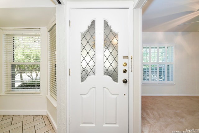 foyer with light carpet