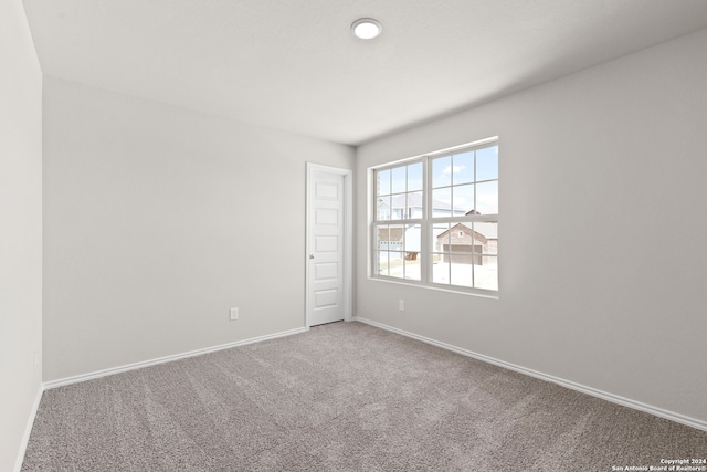 unfurnished room featuring carpet floors