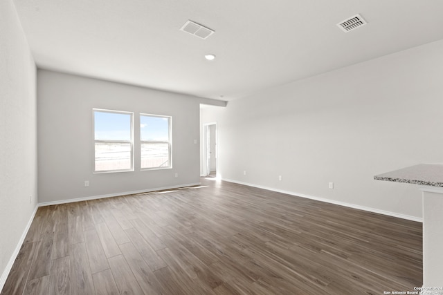 empty room with dark hardwood / wood-style floors