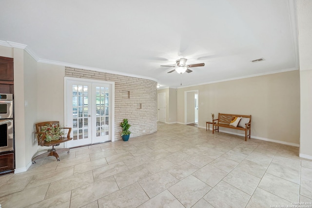 interior space with french doors, brick wall, ceiling fan, and crown molding