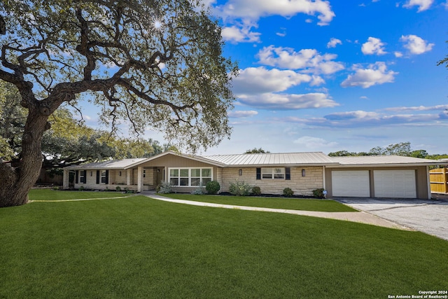 ranch-style home with a garage and a front yard