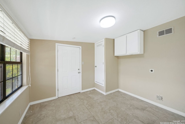 washroom featuring cabinets and electric dryer hookup