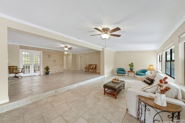 living room with french doors, ceiling fan, and crown molding