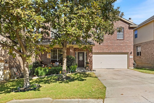 view of front of property with a garage and a front yard