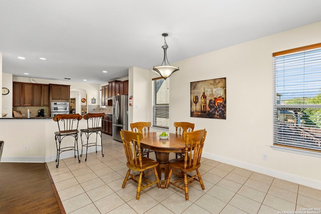 dining area featuring light tile patterned floors