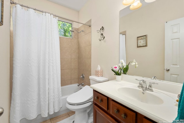 full bathroom featuring toilet, vanity, tile patterned floors, and shower / tub combo