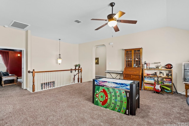 rec room with carpet, vaulted ceiling, and ceiling fan