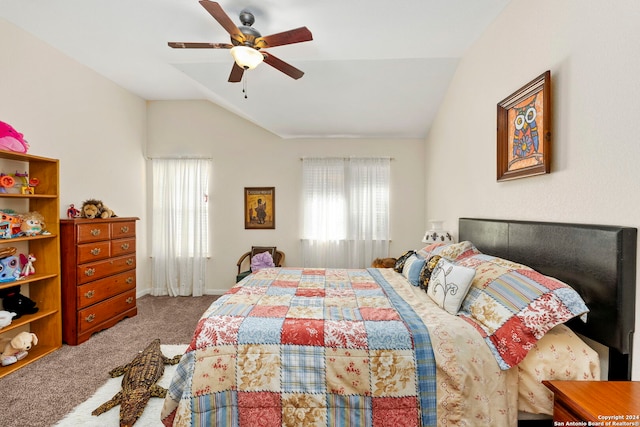 bedroom with ceiling fan, vaulted ceiling, and carpet