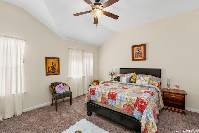 carpeted bedroom with ceiling fan and vaulted ceiling