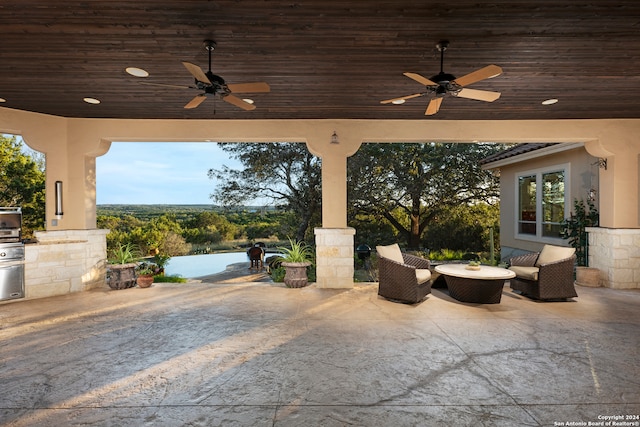 view of patio featuring ceiling fan and an outdoor living space