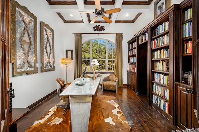 office featuring dark wood-type flooring, coffered ceiling, ceiling fan, crown molding, and beam ceiling