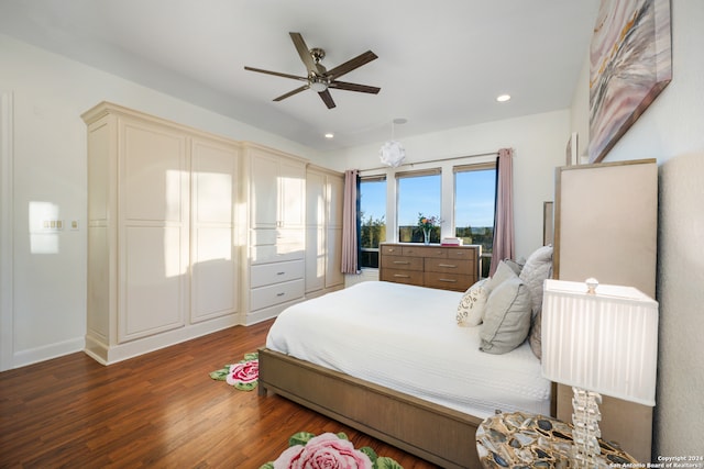 bedroom with ceiling fan and dark hardwood / wood-style floors