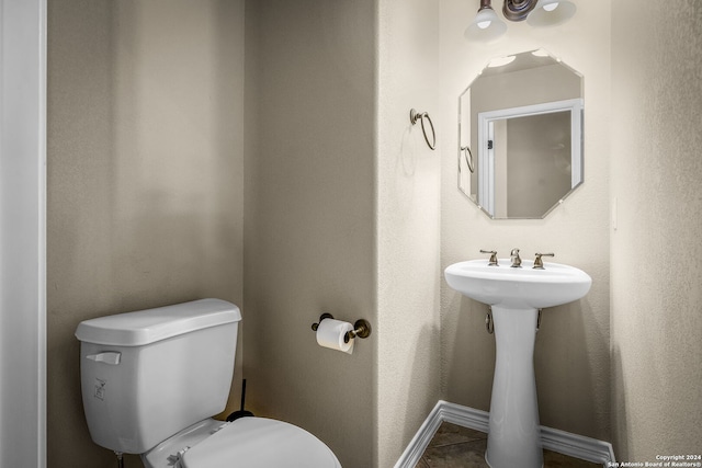 bathroom with tile patterned floors and toilet