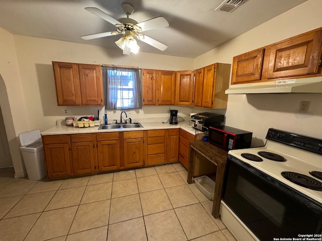 kitchen featuring light tile patterned flooring, ceiling fan, sink, and white range with electric cooktop