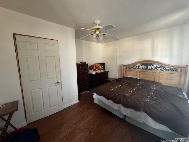 bedroom featuring ceiling fan and dark hardwood / wood-style floors