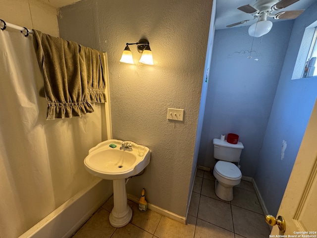 bathroom featuring ceiling fan, tile patterned flooring, and toilet