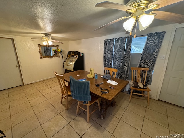 dining room featuring a textured ceiling, ceiling fan, washer / dryer, and light tile patterned floors