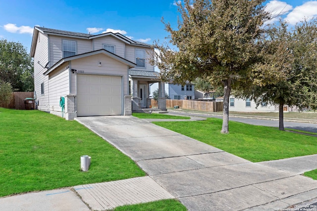 view of front of property featuring a garage and a front lawn