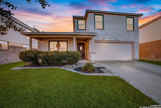 12750 Rambling Rose, San Antonio, TX 78253 - traditional home with an attached garage, concrete driveway, a front yard, and stone siding