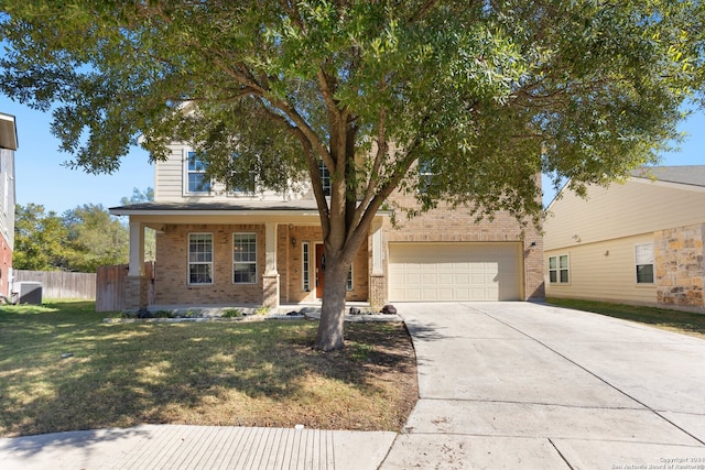 view of front of property with a porch, a garage, a front lawn, and central air condition unit