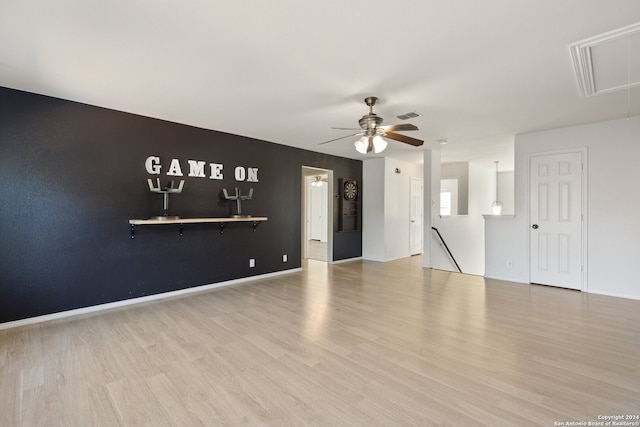 unfurnished living room with light hardwood / wood-style floors and ceiling fan