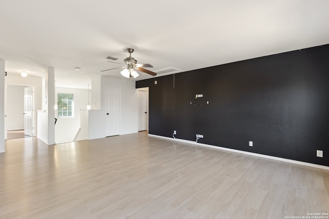 spare room with light hardwood / wood-style floors and ceiling fan