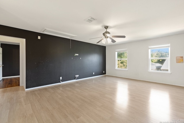 spare room with light hardwood / wood-style flooring and ceiling fan