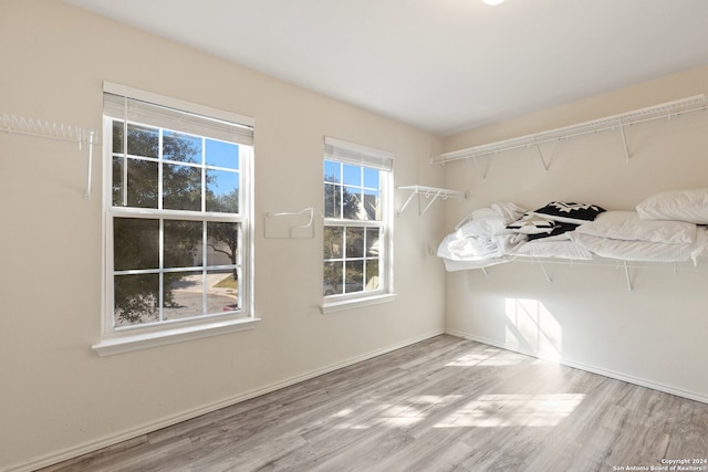 spacious closet featuring hardwood / wood-style floors