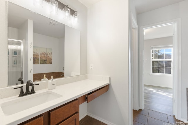 bathroom with tile patterned flooring and vanity