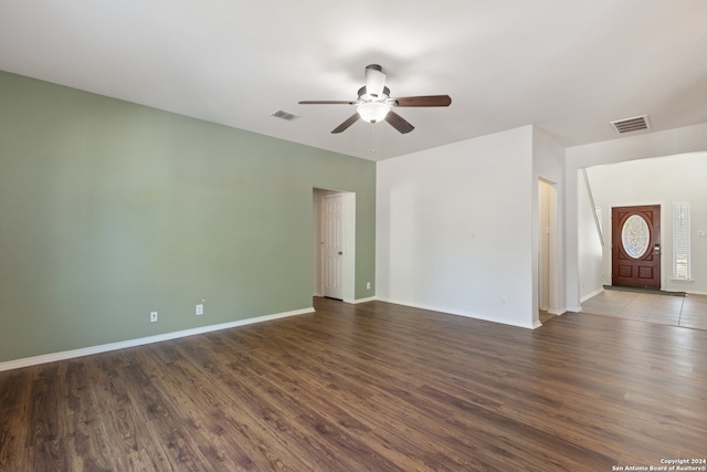 empty room featuring hardwood / wood-style flooring and ceiling fan