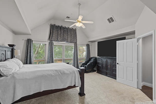 carpeted bedroom featuring lofted ceiling and ceiling fan