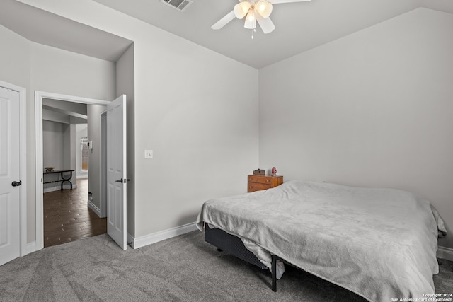 bedroom featuring ceiling fan, wood-type flooring, and vaulted ceiling