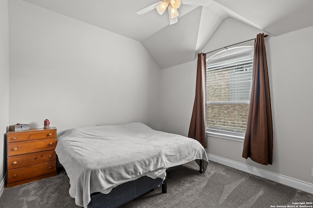 bedroom featuring lofted ceiling, ceiling fan, and dark carpet