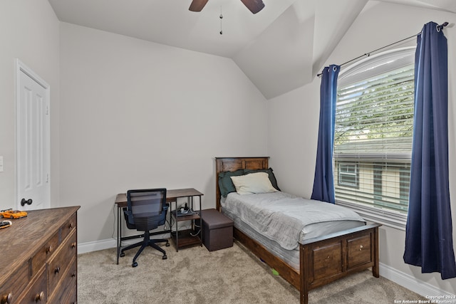 bedroom with light carpet, ceiling fan, and lofted ceiling