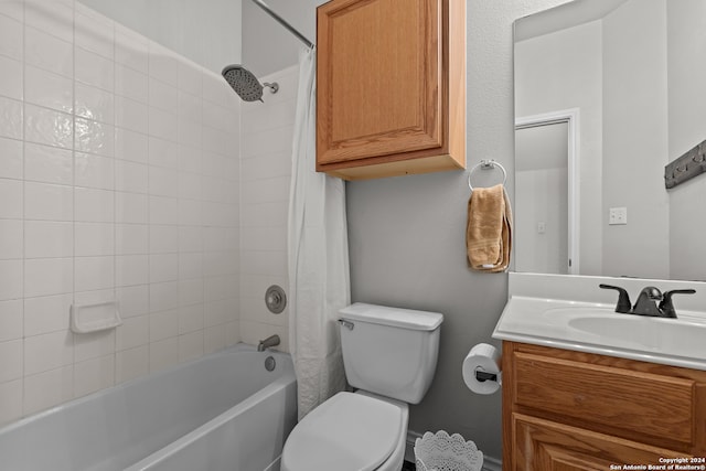 full bathroom featuring vanity, shower / bath combo with shower curtain, and toilet