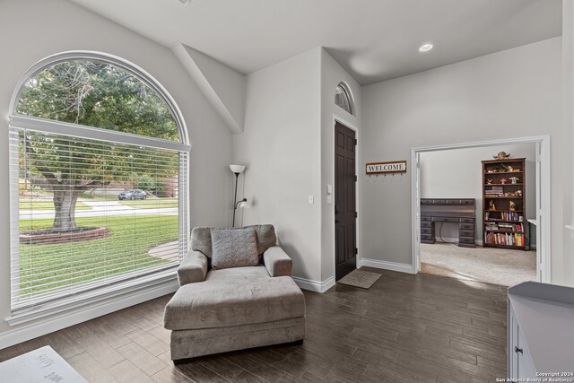 living area with hardwood / wood-style flooring