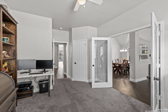 office area featuring dark hardwood / wood-style floors, ceiling fan with notable chandelier, and french doors