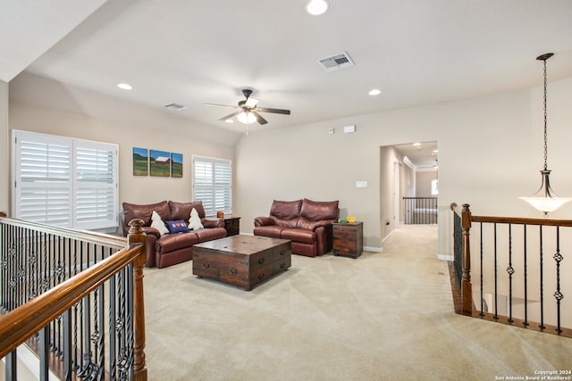 carpeted living room featuring ceiling fan