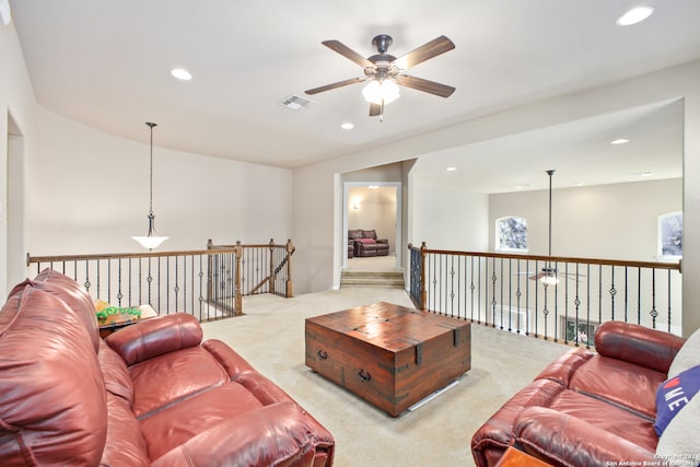 living room featuring light carpet and ceiling fan