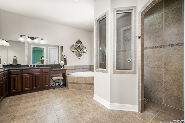 bathroom with tile patterned flooring, vanity, and independent shower and bath