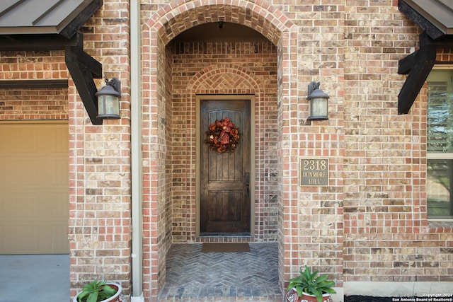 property entrance with a garage