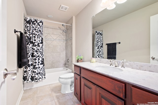 full bathroom with toilet, vanity, shower / bath combo with shower curtain, and tile patterned floors