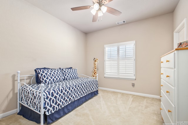 bedroom with ceiling fan and light colored carpet