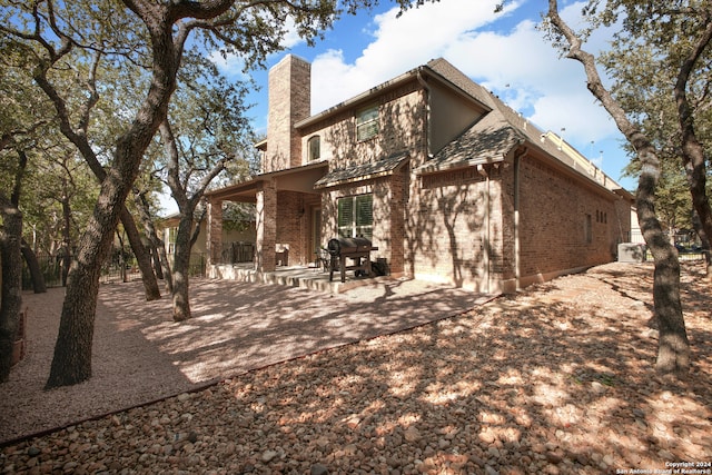 back of house with a patio