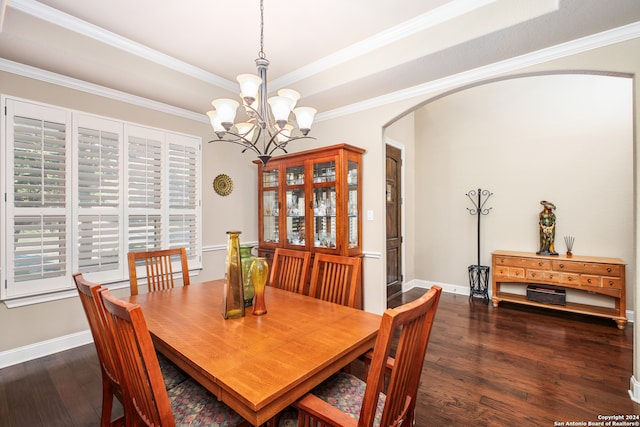 dining room with dark hardwood / wood-style floors and crown molding