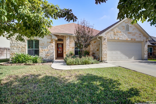 view of front of house featuring a garage and a front yard