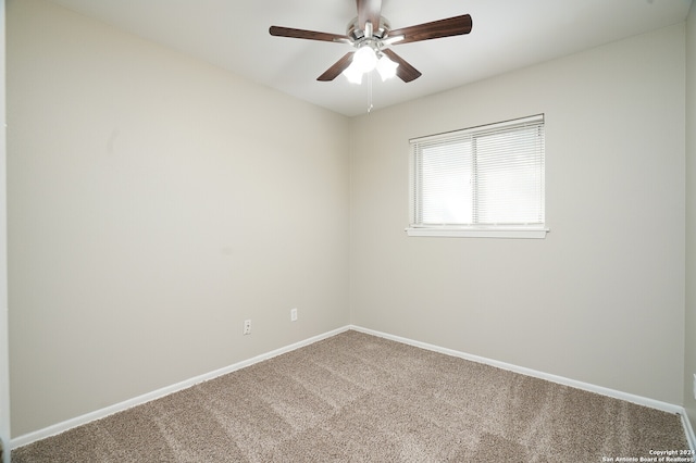 spare room with carpet floors and ceiling fan