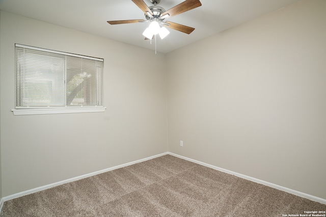 unfurnished room with carpet flooring and ceiling fan