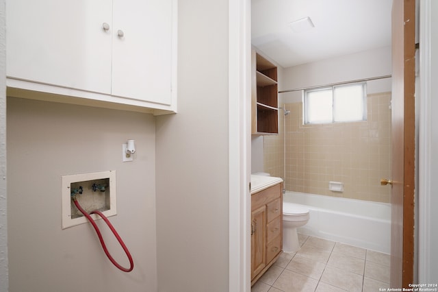 full bathroom with vanity, tile patterned floors, toilet, and tiled shower / bath