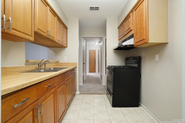 kitchen featuring light tile patterned flooring, black range with electric stovetop, and sink